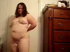 I strip and masturbate in my overweight love tunnel while alone on a webcam.